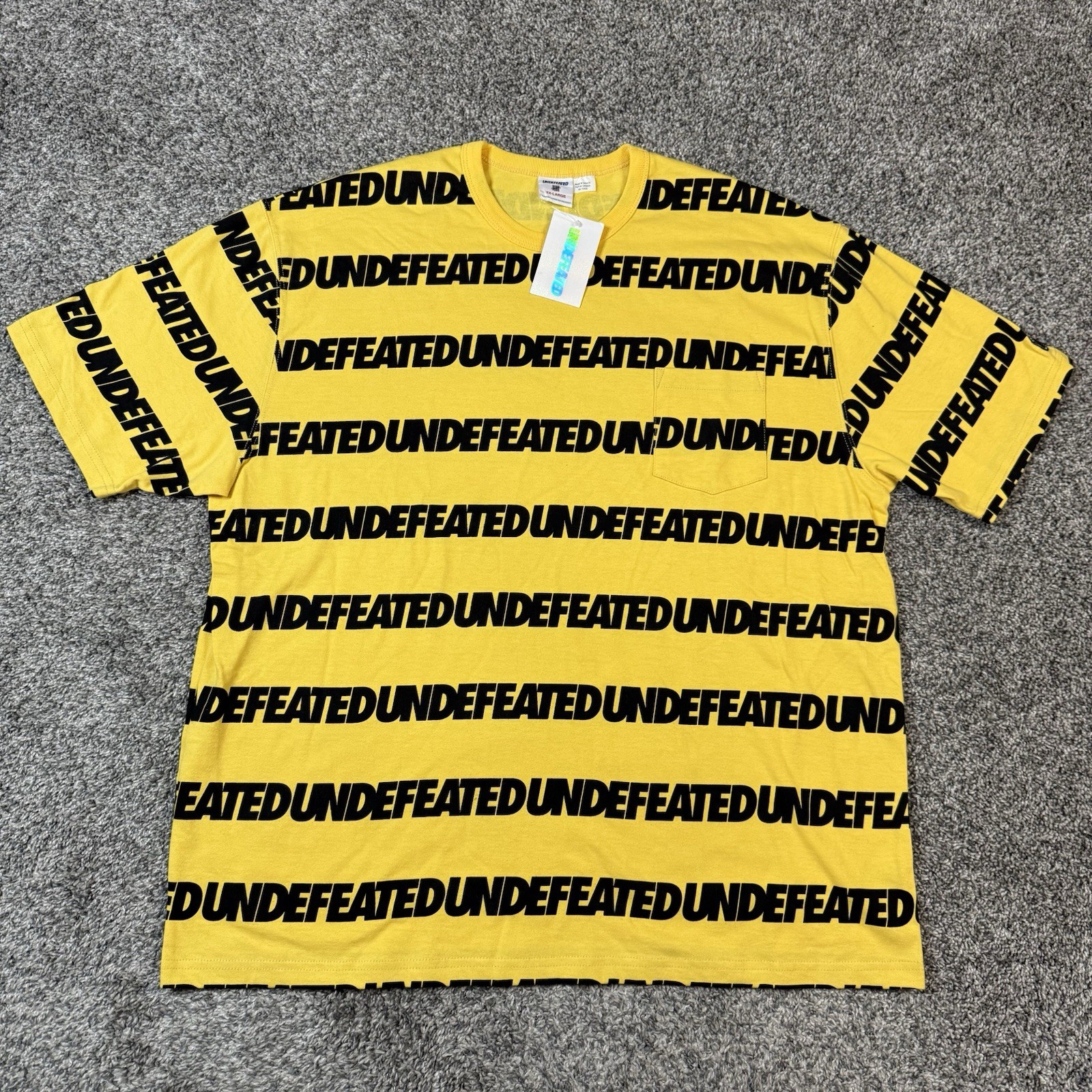 Undefeated All Over Print Aop Spellout Streetwear Pocket T Shirt Size 2XL NEW