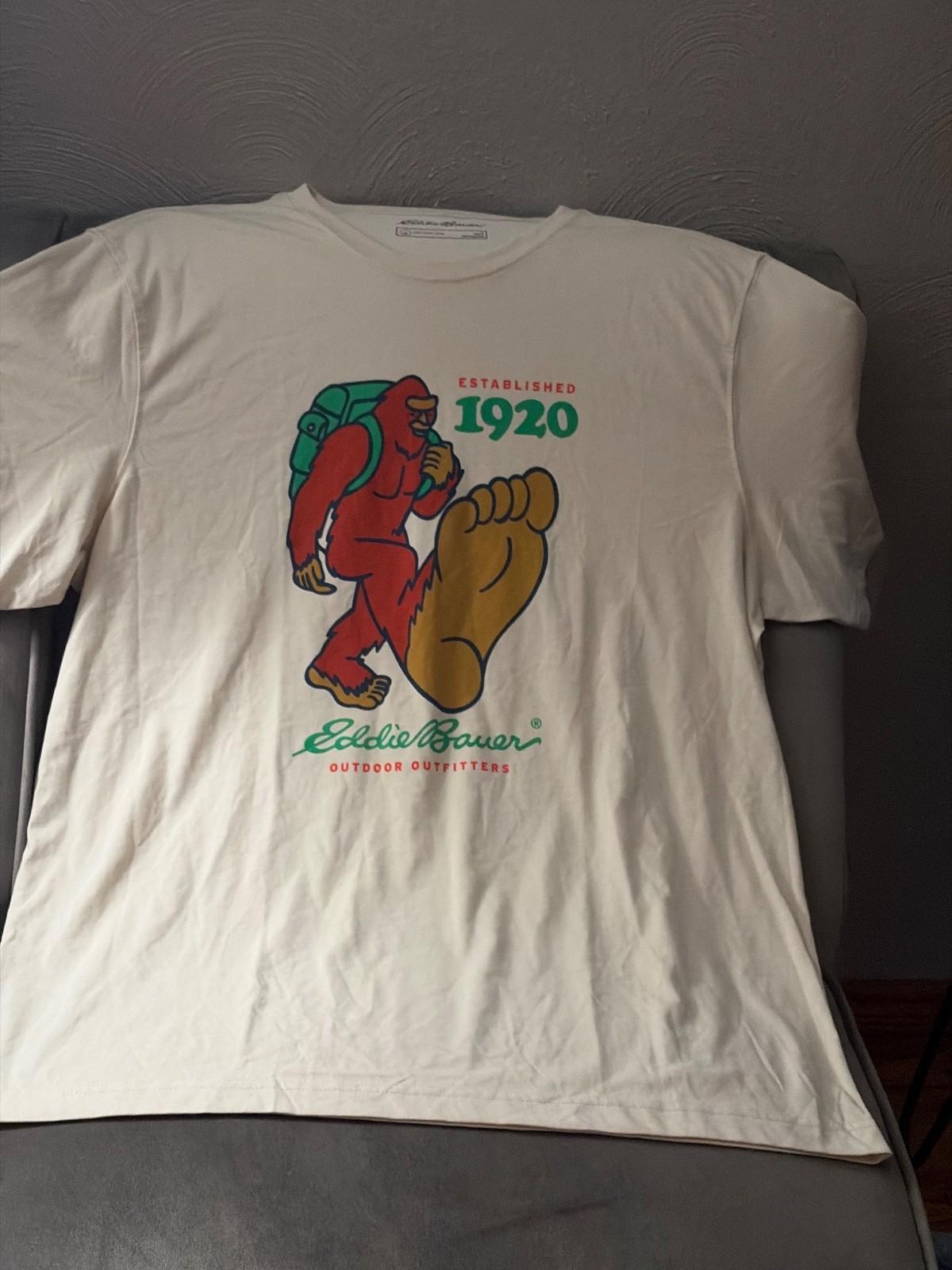 Eddie Bauer Sasquatch t-shirt features a red bigfoot graphic with a g