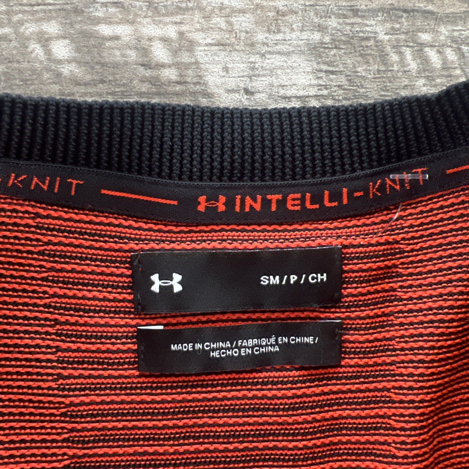 Small Under Amour 1366503 002 Men's IntelliKnit 1/4 Zip Shirt black orange $85 gallery