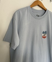 Lost Enterprises Men’s Short Sleeve Tshirt Light Blue W/ Red White And Blue Logo
