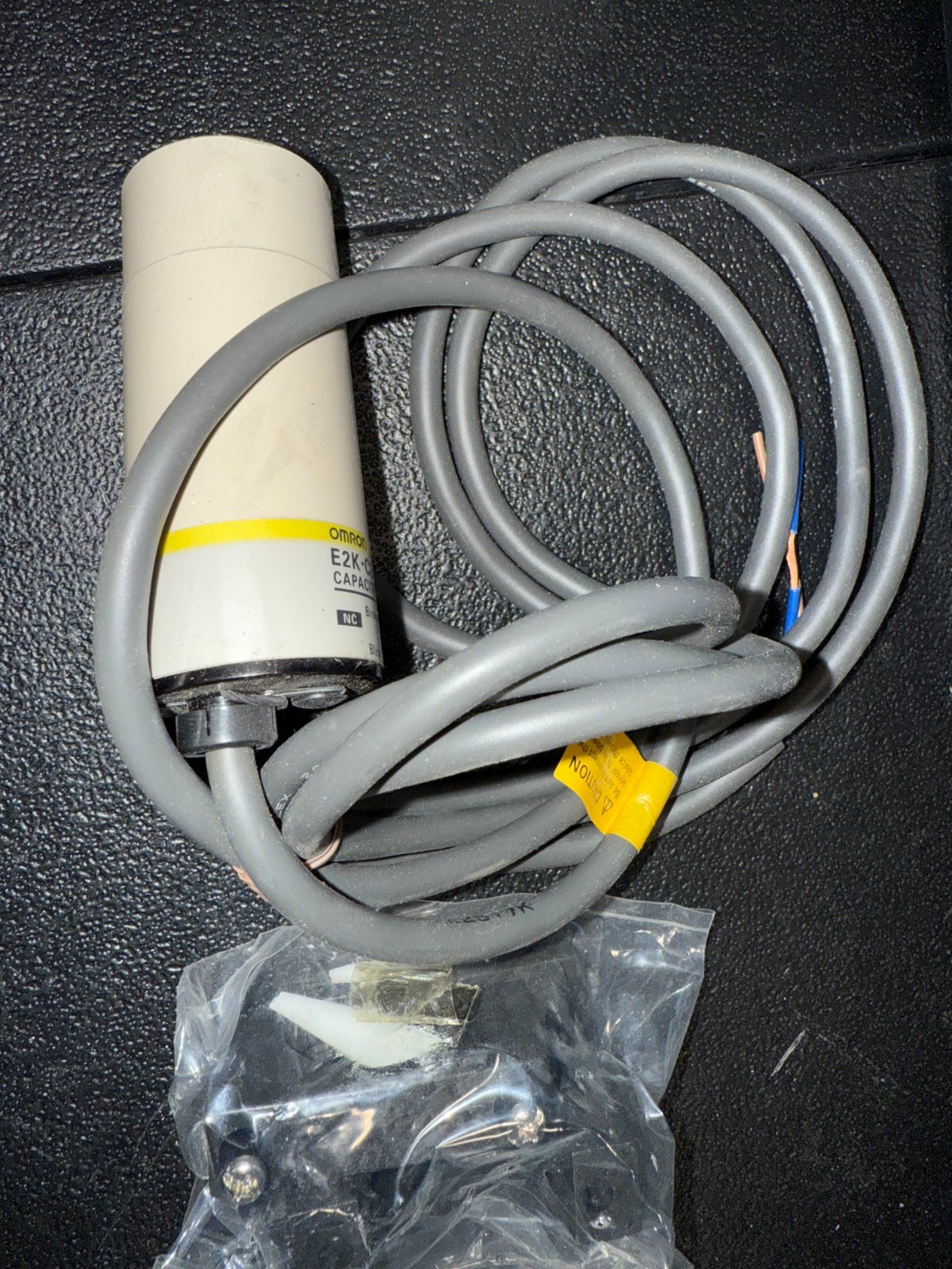 New In Box OMRON E2K-C25MY2 Proximity Sensor With Mounting Bracket.