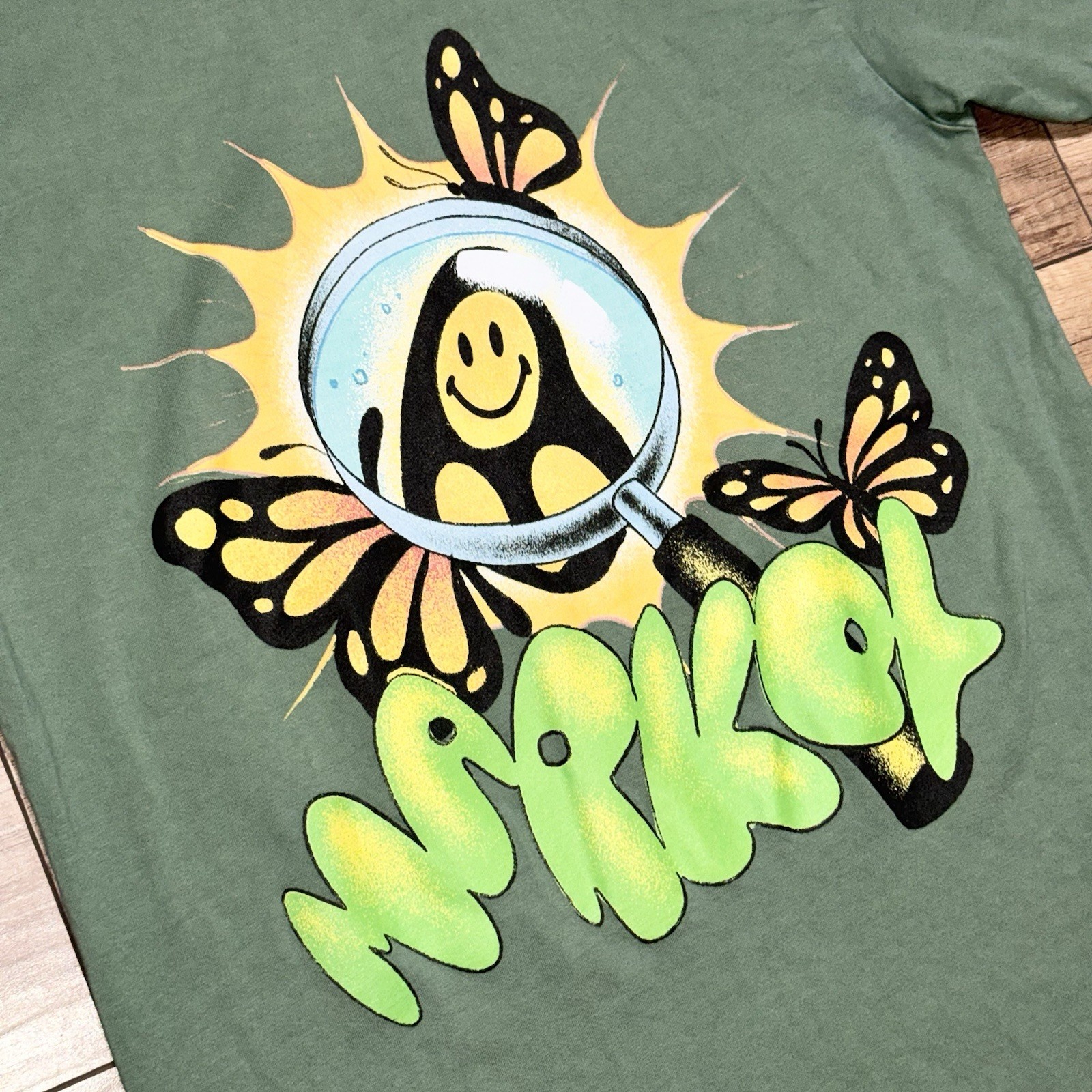 Chinatown Market Smiley Streetwear Green Butterfly Art Graphic T Shirt Mens S gallery