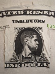 USHER United Reserve UshBucks One Dollar The Colosseum Graphic T-Shirt MED Adult