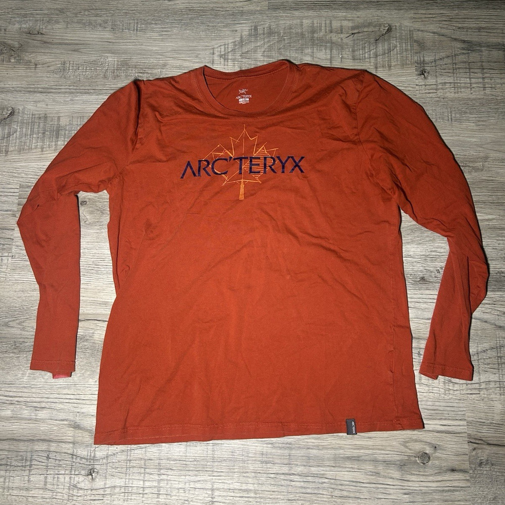 Arc’teryx Men’s Orange Long Sleeve Crew Neck Tee Size L Small stain on sleeve