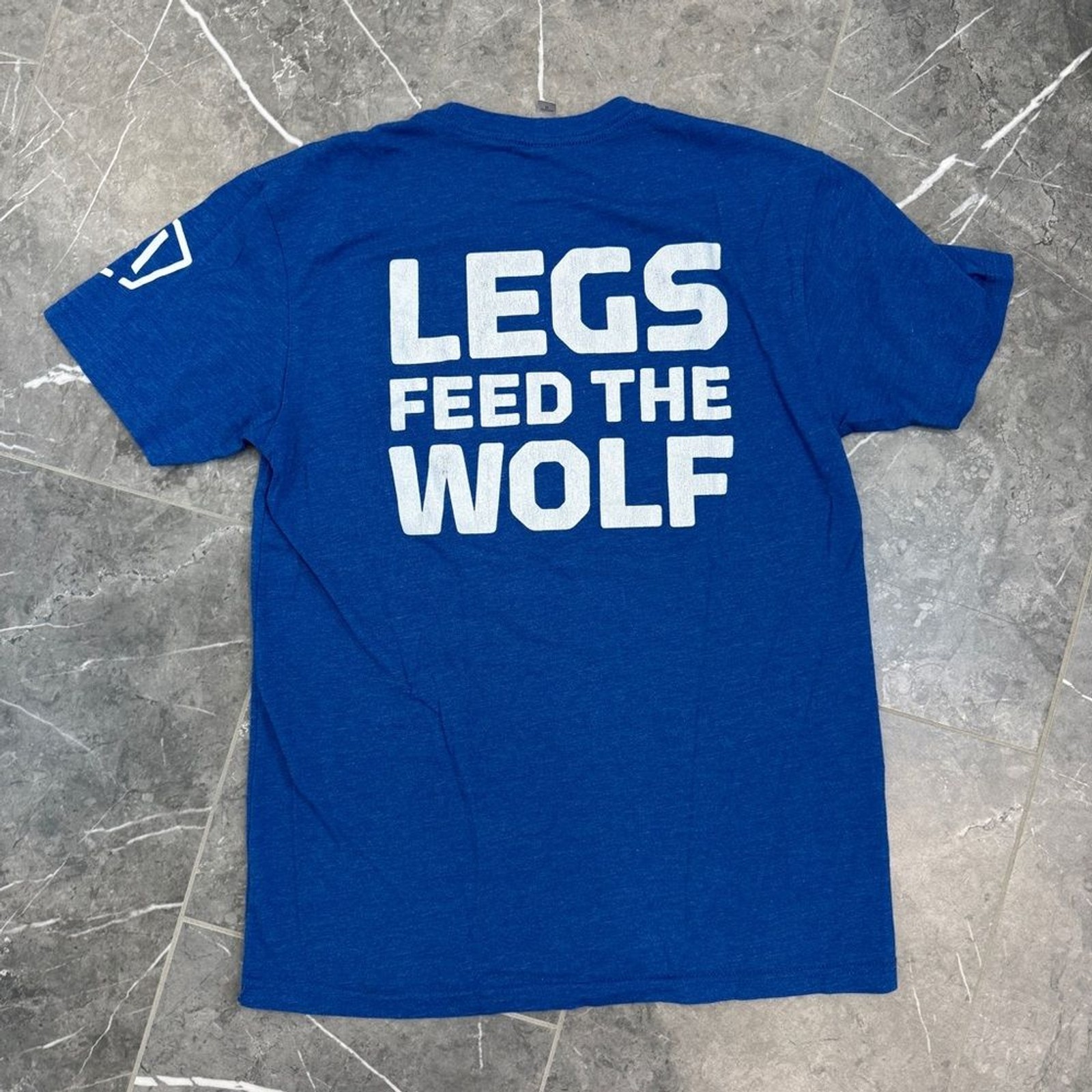 Atomic Athlete Blue Legs Feed The Wolf Mens Graphic TShirt Size M gallery