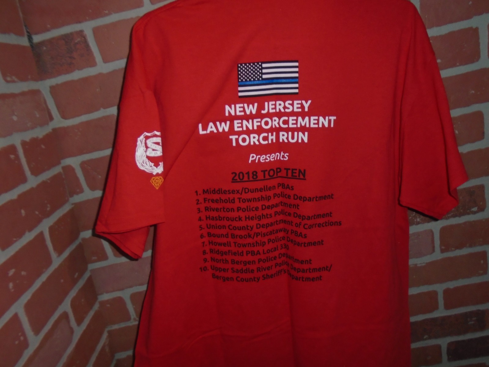 36TH ANNUAL LAW ENFORCEMENT TORCH RUN 2019 MENS TSHIRT WORN 1 TIME gallery