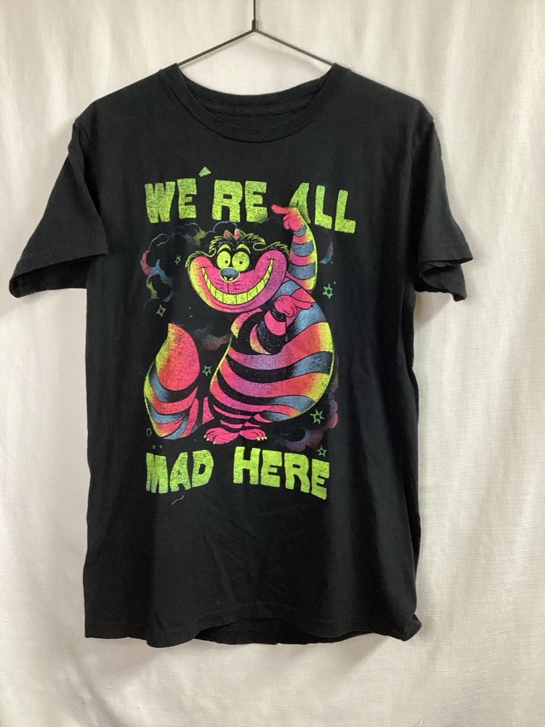 Disney Alice In Wonderland Cheshire Cat We’re All Mad Here Neon Graphic T-Shirt