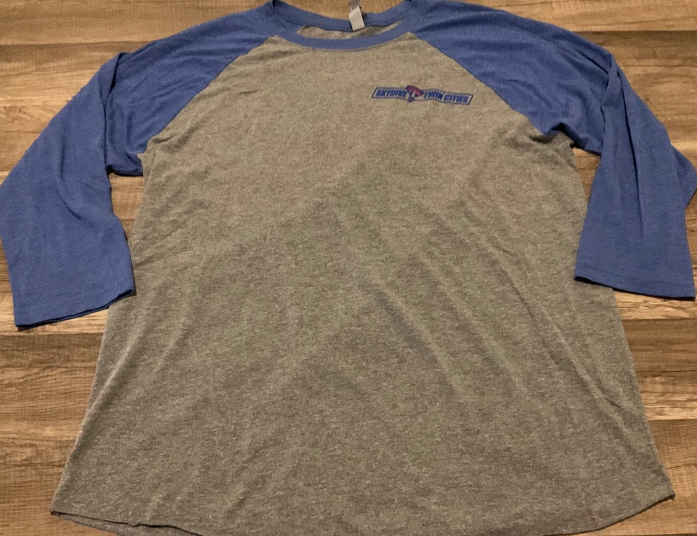 NEXT LEVEL BASEBALL RAGLAN SKYDIVING TWIN CITIES GRAPHIC ( MENS L ) HEATHER BLUE gallery