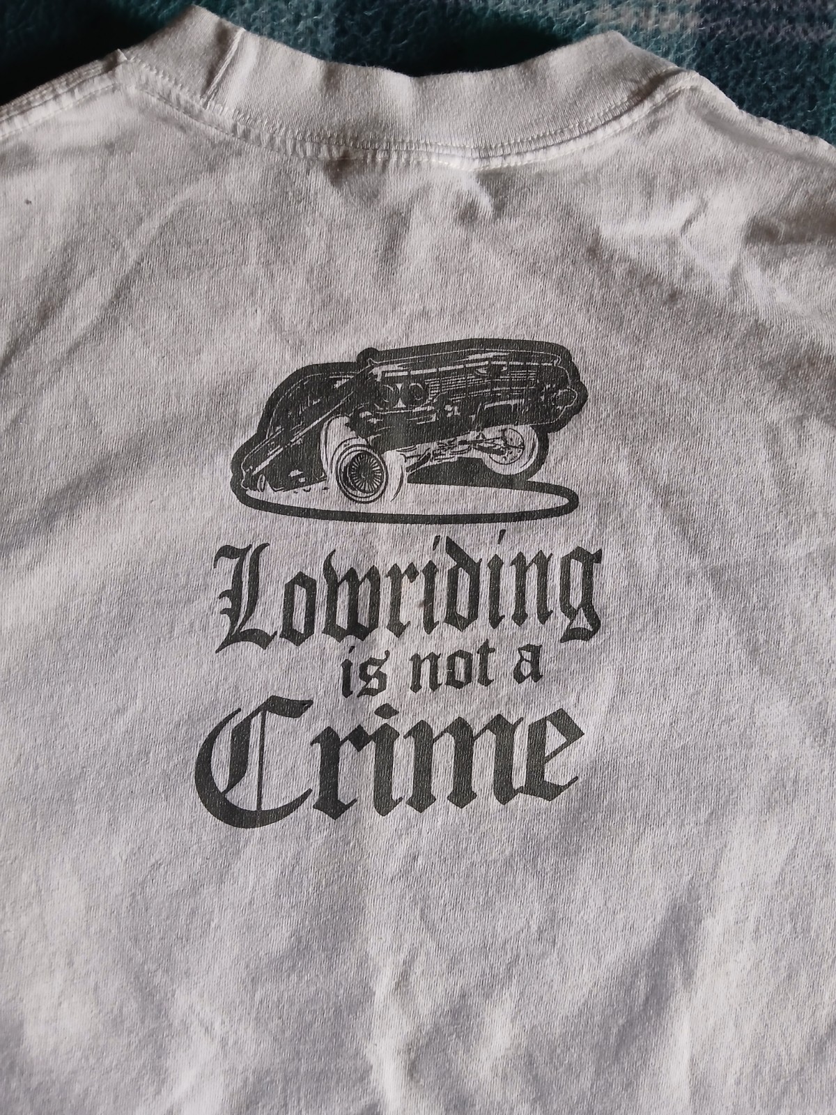 T-Shirt "Lowriding is not a Crime" design printed on a Shaka Wear blank Size L gallery
