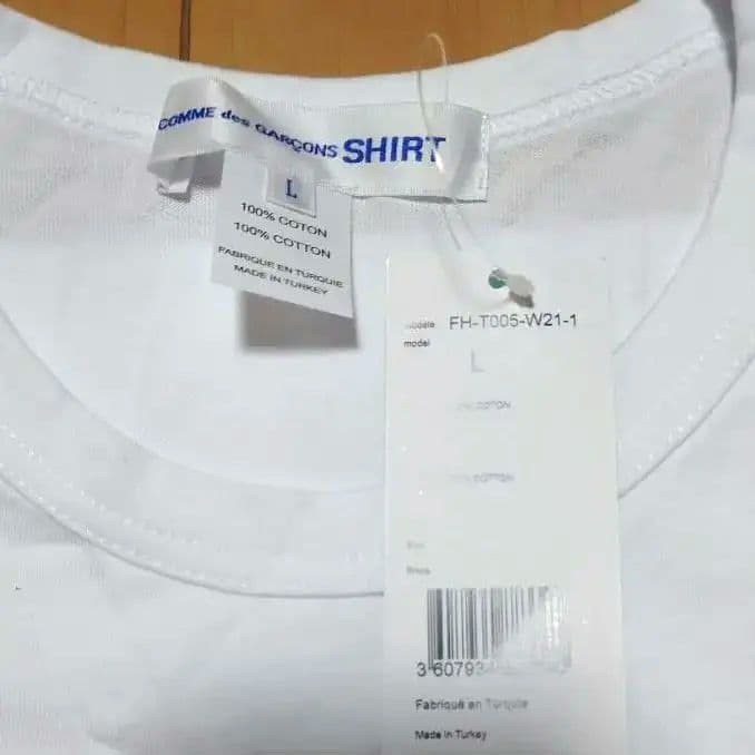 USED BRAND NEW COMME DES GARCONS SHIRT X KAWS PRINT TEE (NOT AVAILABLE JAPAN) gallery