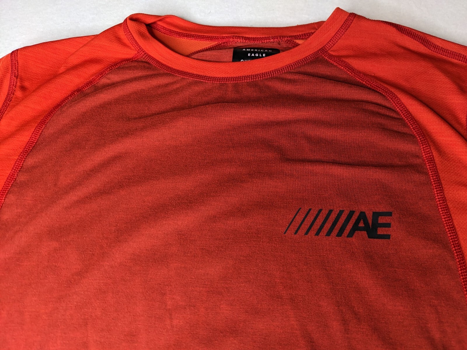 American Eagle Shirt Mens medium active wear red small hole back see photo gallery
