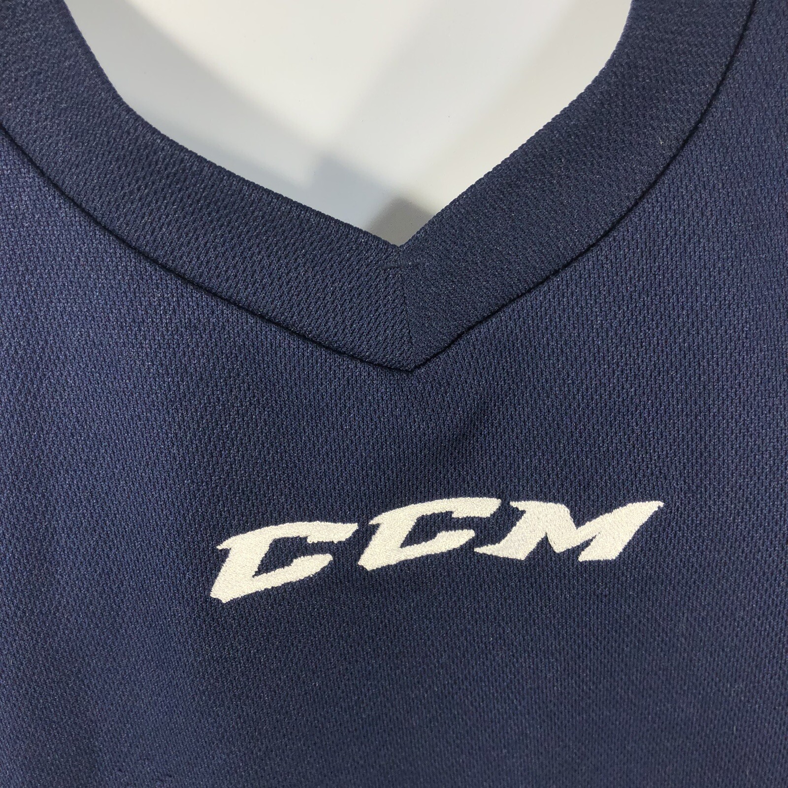 CCM NAVY BLUE V NECK BLANK SIZE SMALL HOCKEY SHIRT WHITE EMBROIDERED LOGO gallery