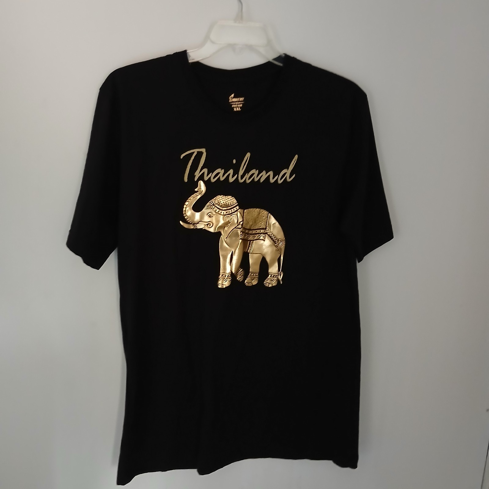 Thailand souvenir shirt featuring a detailed gold-colored elephant gallery