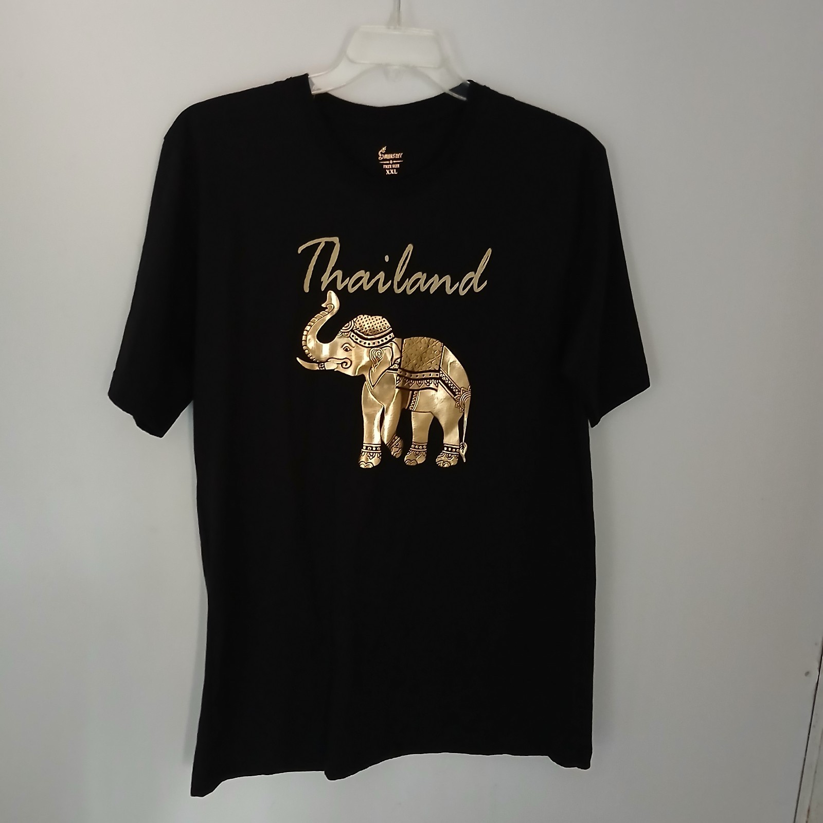Thailand souvenir shirt featuring a detailed gold-colored elephant gallery