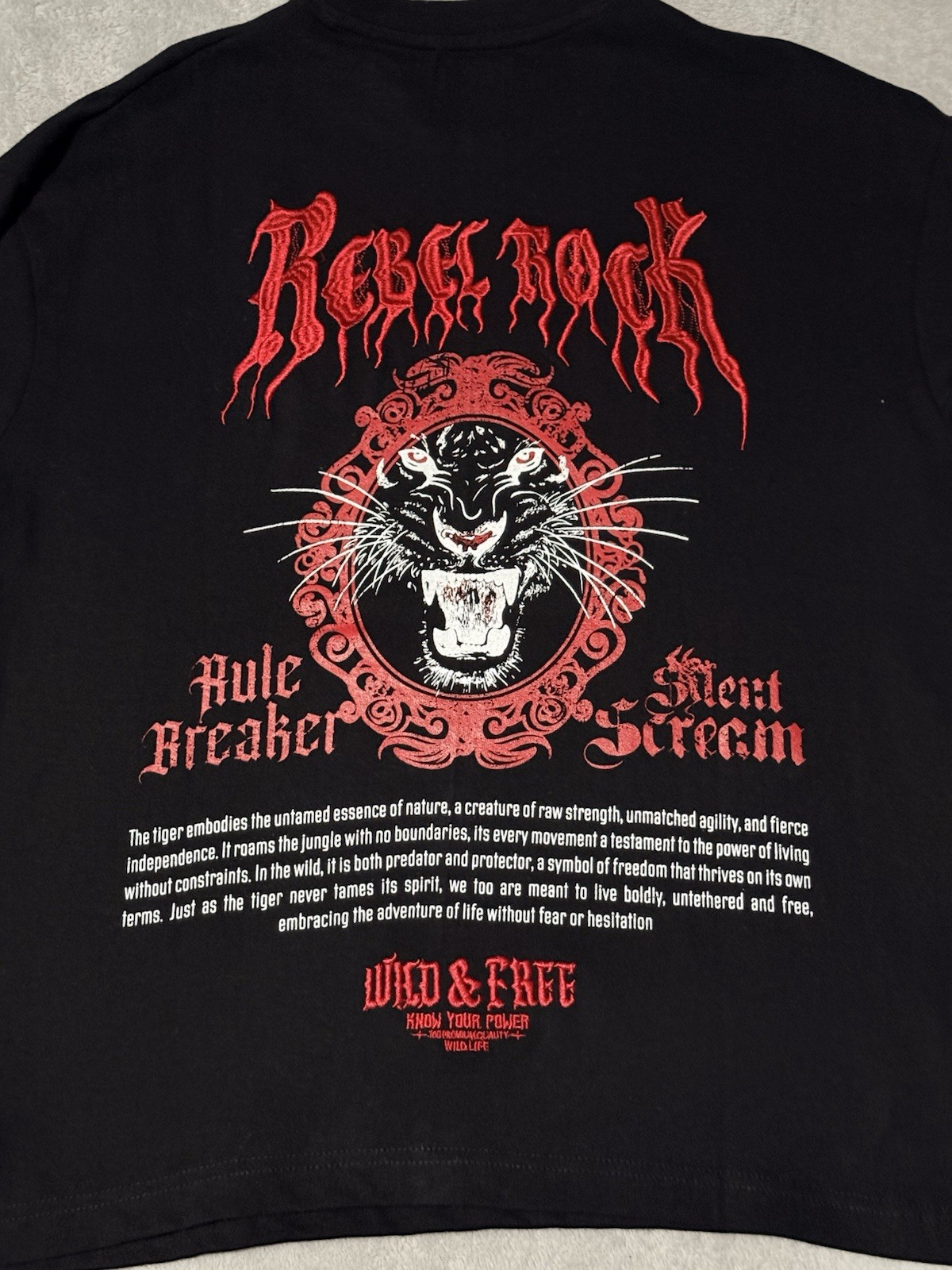 black cotton t-shirt features a bold red embroidered panther graphic Size Small gallery