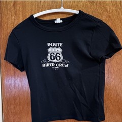 Tee from Garage, size s. Struggled to put on hanger, not actually off center.