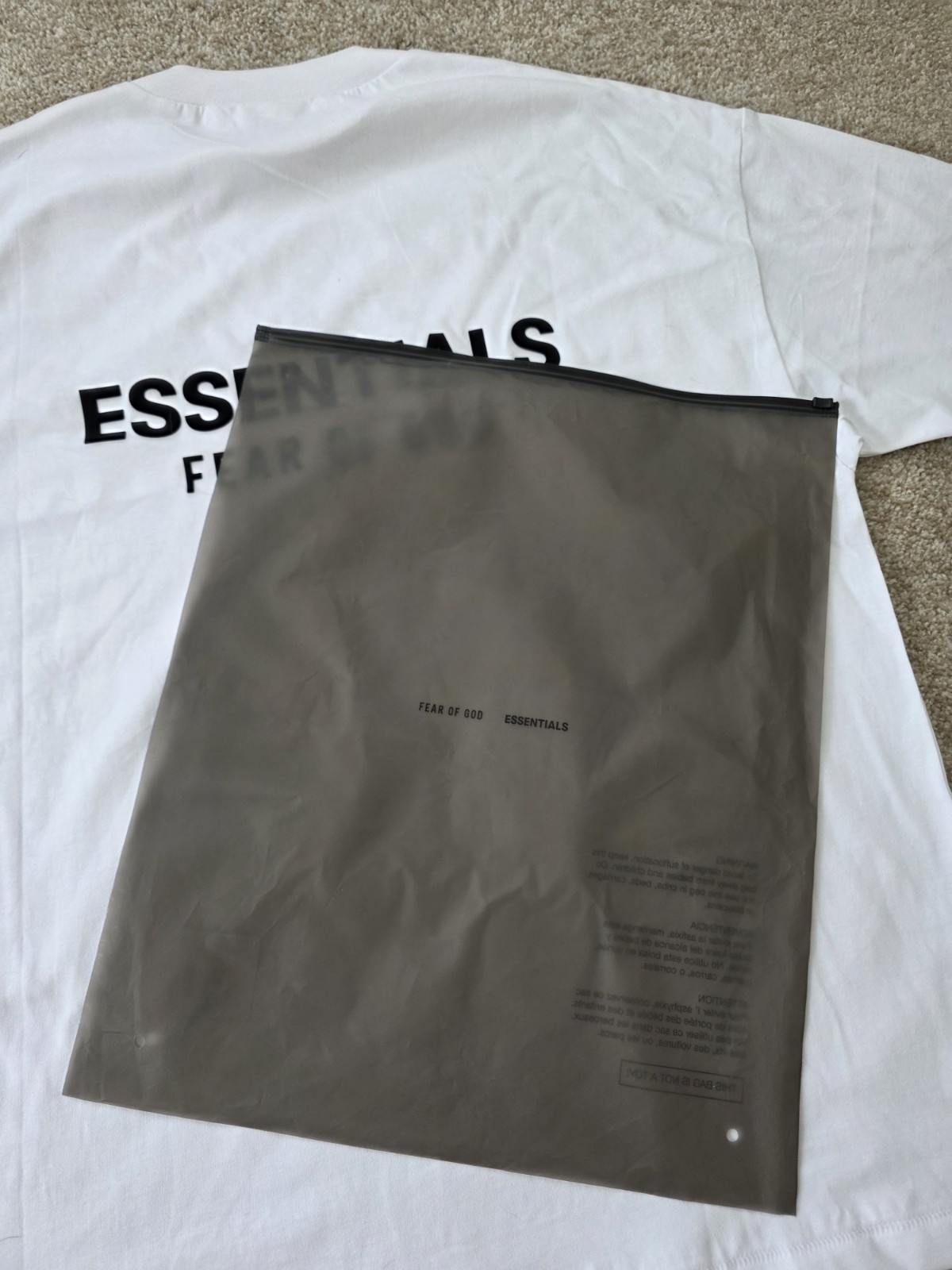 Fear of God Essentials Men's White Crew Neck Short Sleeve Logo Graphic Tee gallery