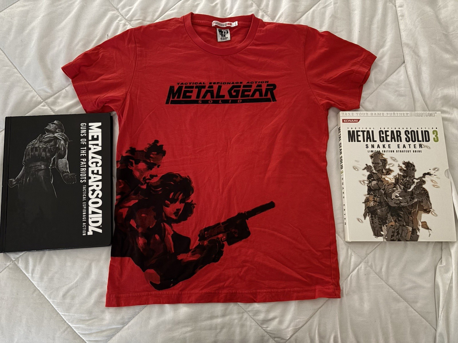 Metal Gear Solid collector lot with Uniqlo 25th Anniversary shirt