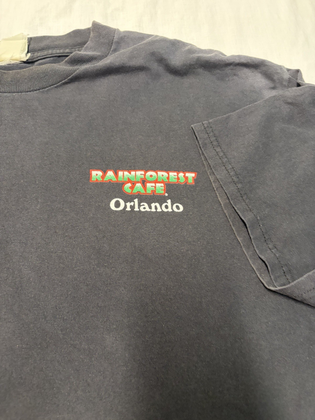 Vtg Rainforest Cafe Orlando XL Black Faded What Happens In The Jungle Stays gallery