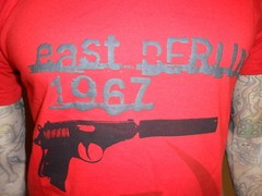 SARAVANA VOGELPOHL TSHIRT Designer Boutique Brand BERLIN Gun ESPIONAGE Red MED