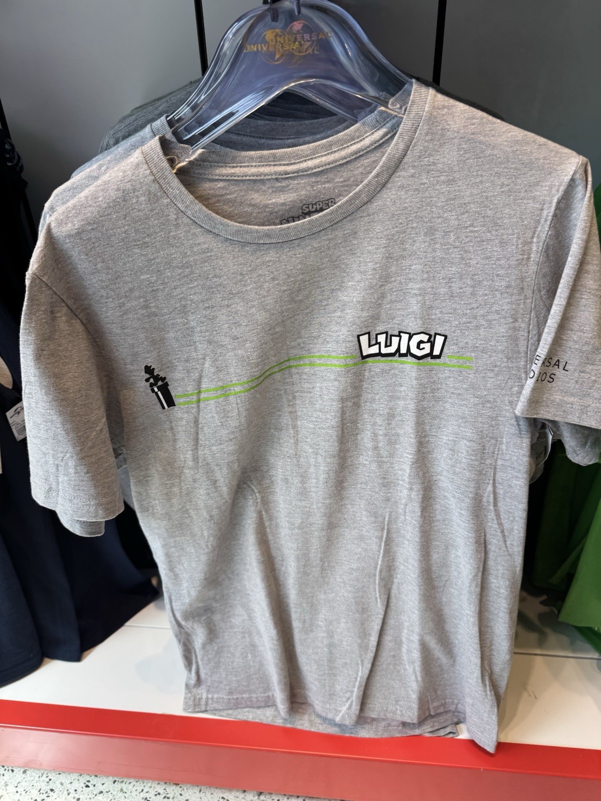 Universal Studios Epic Universe Super Nintendo World Luigi Green Shirt NWT 2025 gallery