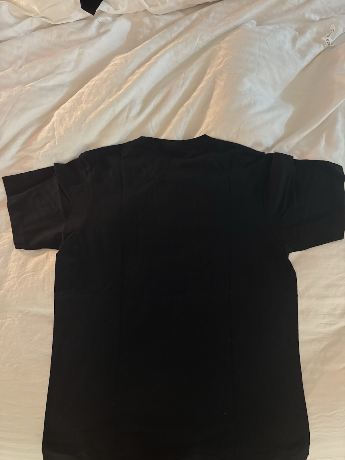 Uniqlo UT x KAWS Men's Black Short Sleeve Crew Neck Pocket Graphic Tee M gallery