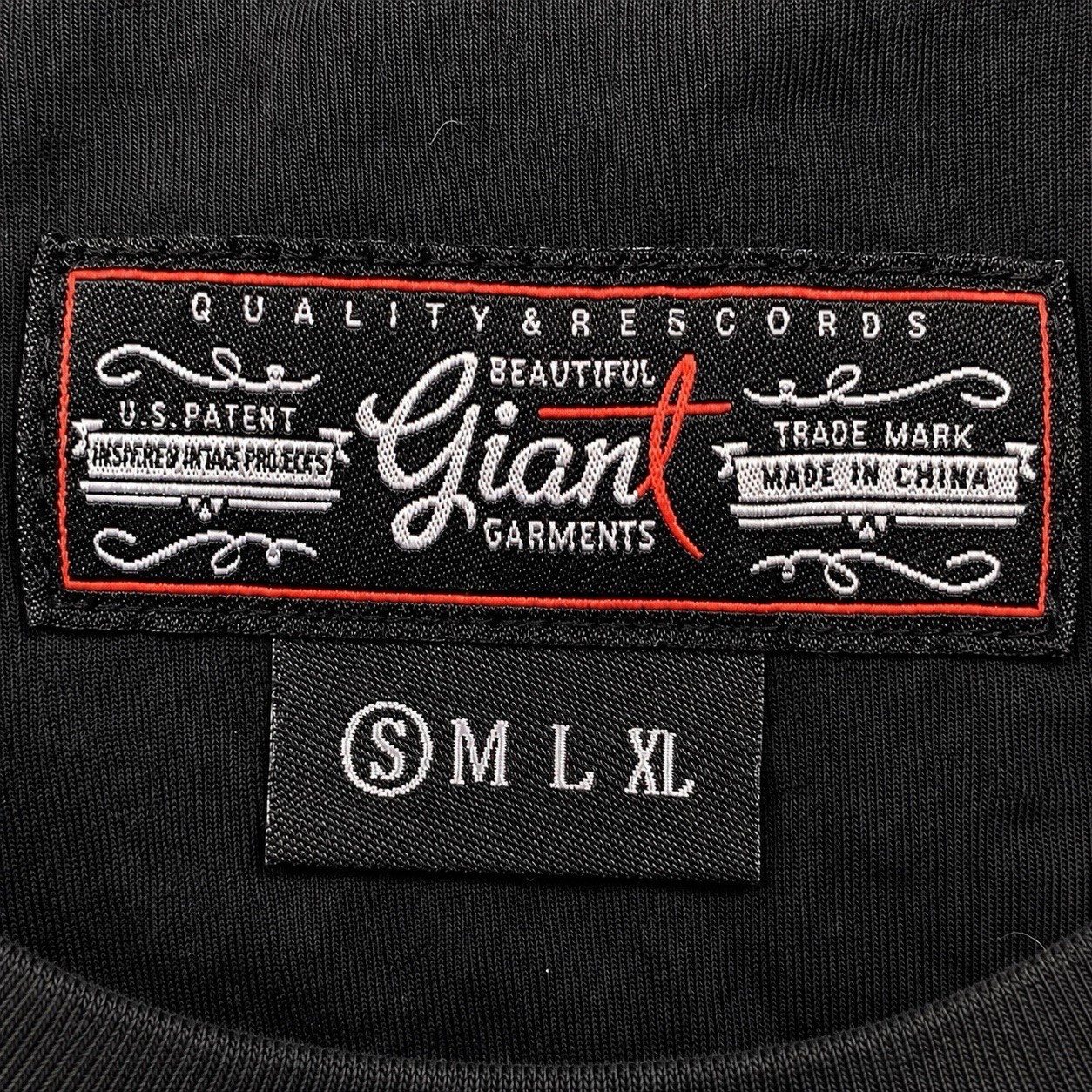 Beautiful Giant Garments black pocket tee with colorful woven/tribal pocket gallery