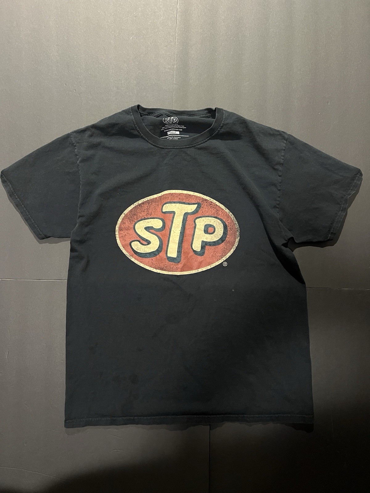 Y2K STP black cotton t-shirt Size L has a kilt stain as shown in last slide