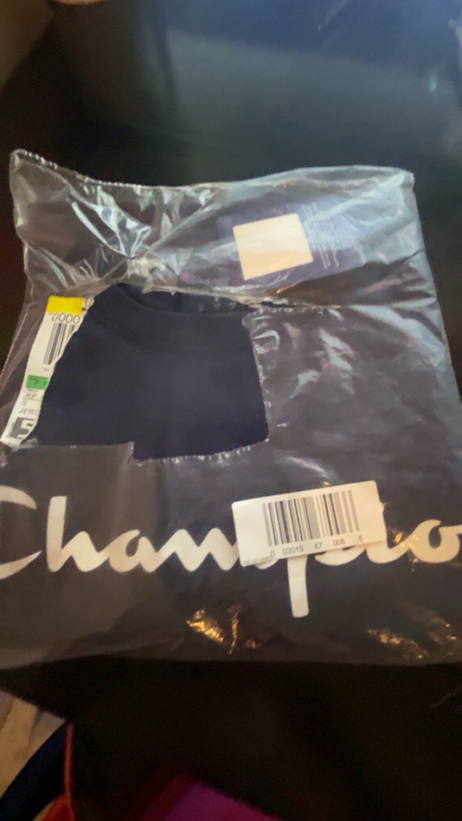 Three champion T-shirts, and one pair of socks gallery