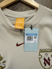 Nike NOCTA Cricket Association Tee – Size M – Light Orewood Brown IB5673-104