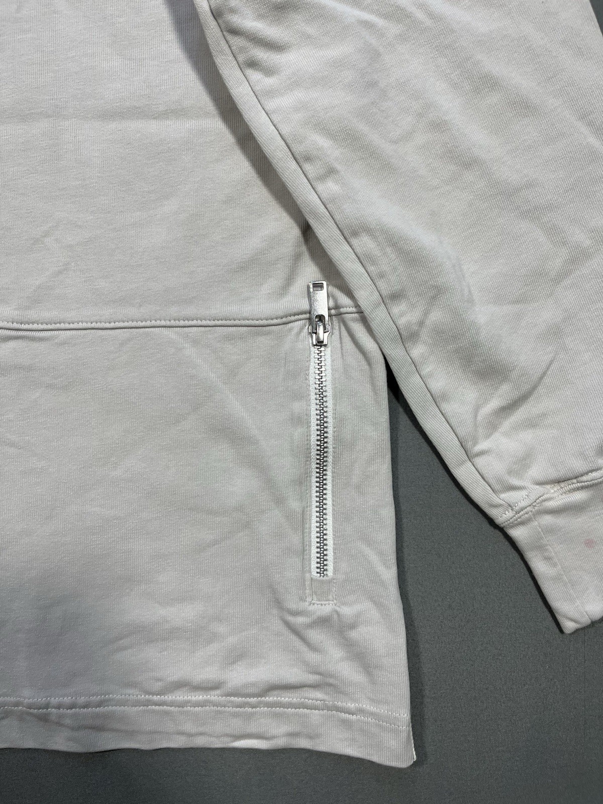 Nike long sleeve mock neck top in Light Bone featuring a small swoosh logo gallery