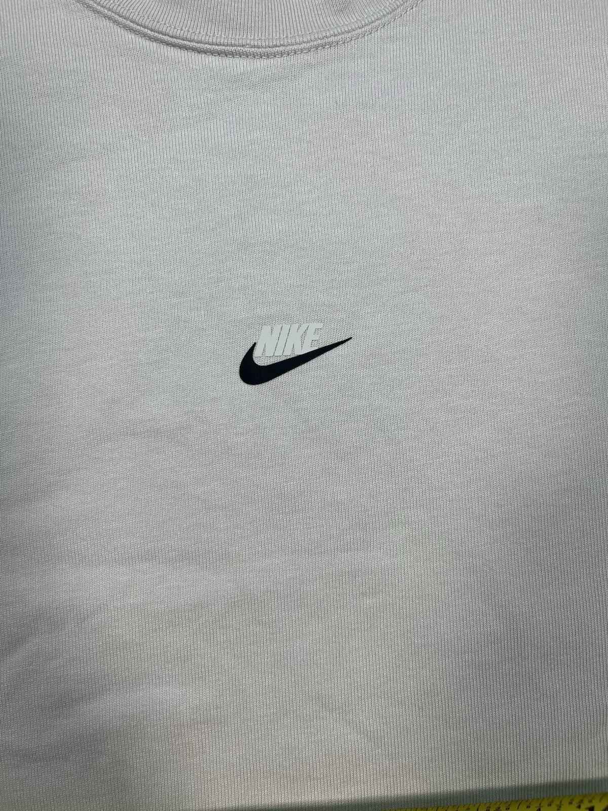 Nike long sleeve mock neck top in Light Bone featuring a small swoosh logo gallery