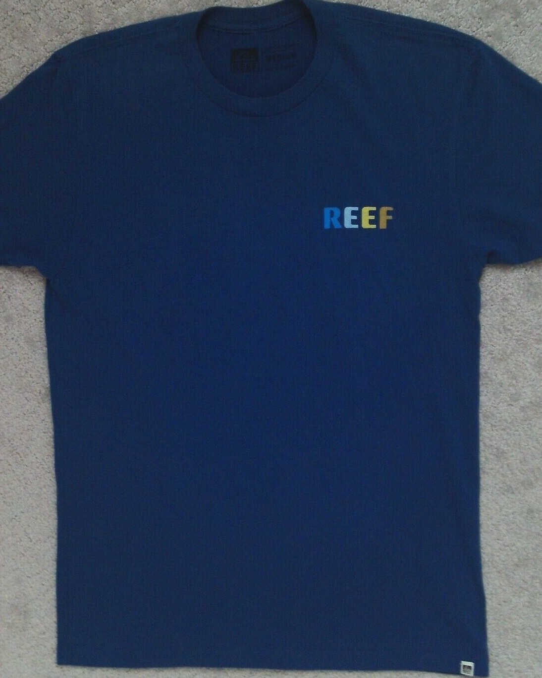 REEF T Shirt _ Size Medium - runs small see measurement gallery