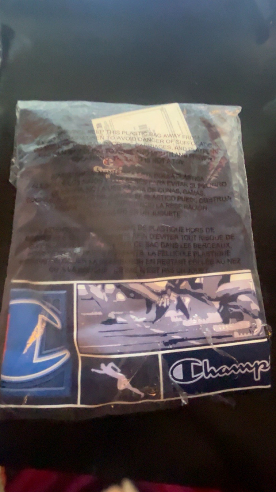 Three champion T-shirts, and one pair of socks gallery