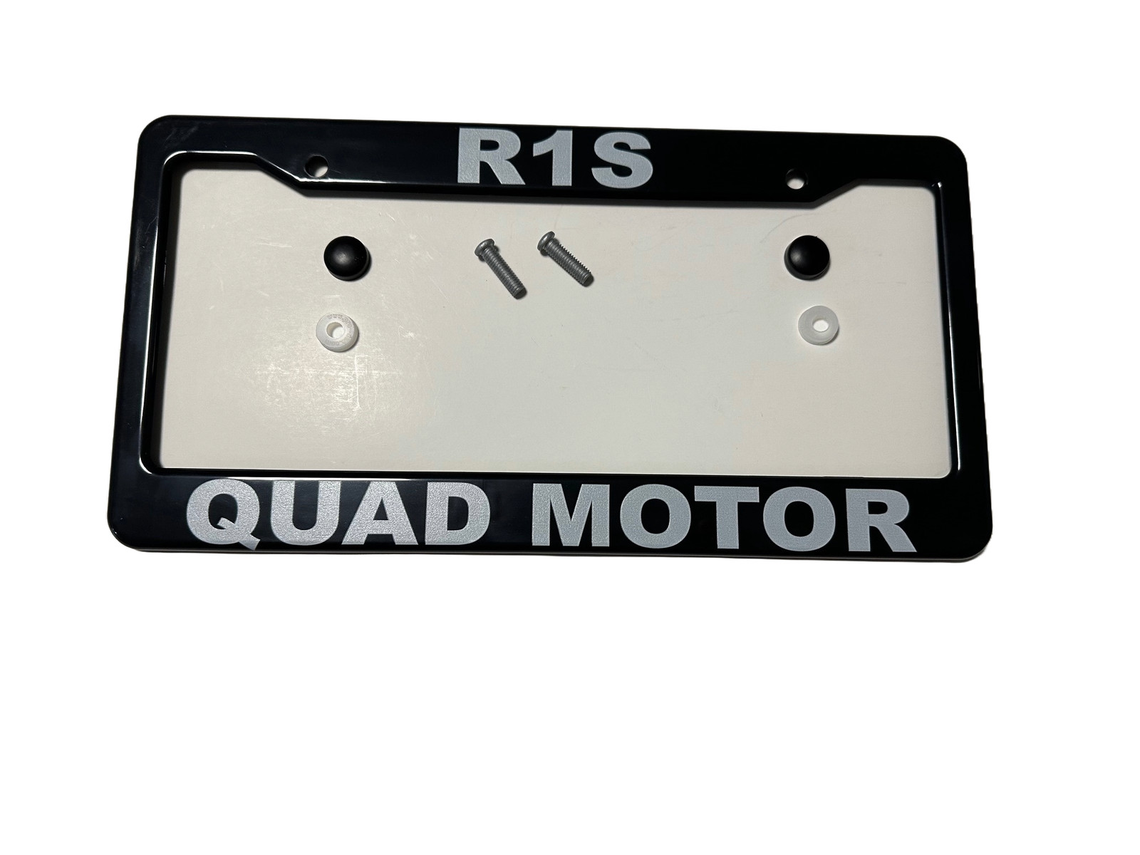 Black ABS License Plate Frame with lettering “R1S Quad Motor” for Rivian R1S