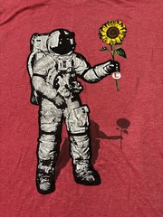Junior Mens Dellarious Red Astronaut Holding Flower Graphic T-shirt. Size Large