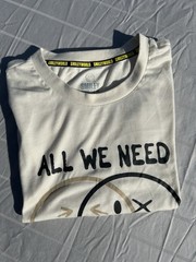 Smiley World ” All We Need Is Positivity ” Off White Mens T-Shirt L/G New w/oTag