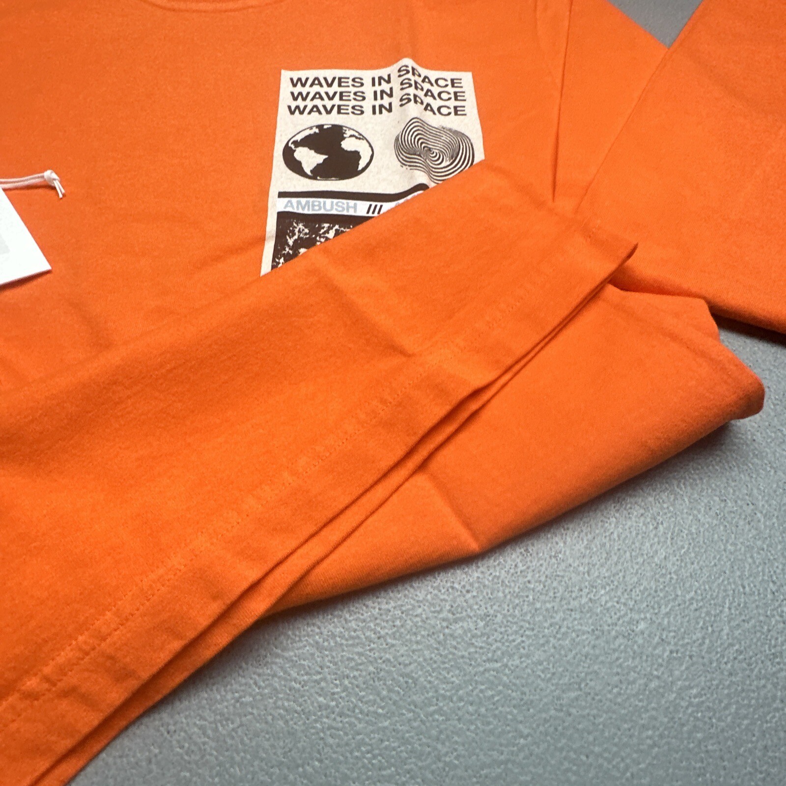 AMBUSH VISITOR LONG SLEEVED T-SHIRT WAVES IN SPACE ORANGE gallery