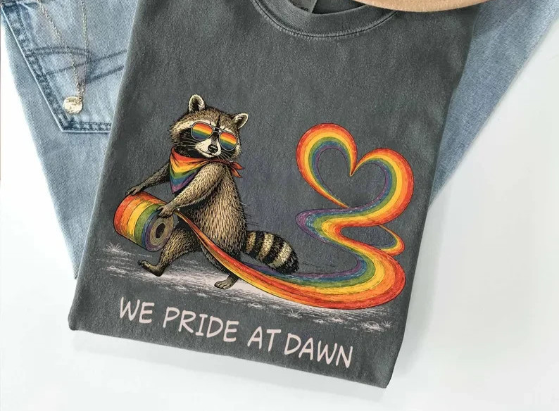 We Pride At Dawn Shirt, LGBTQ Raccoon Pride Tee, Rainbow Heart Graphic T-Shirt, gallery