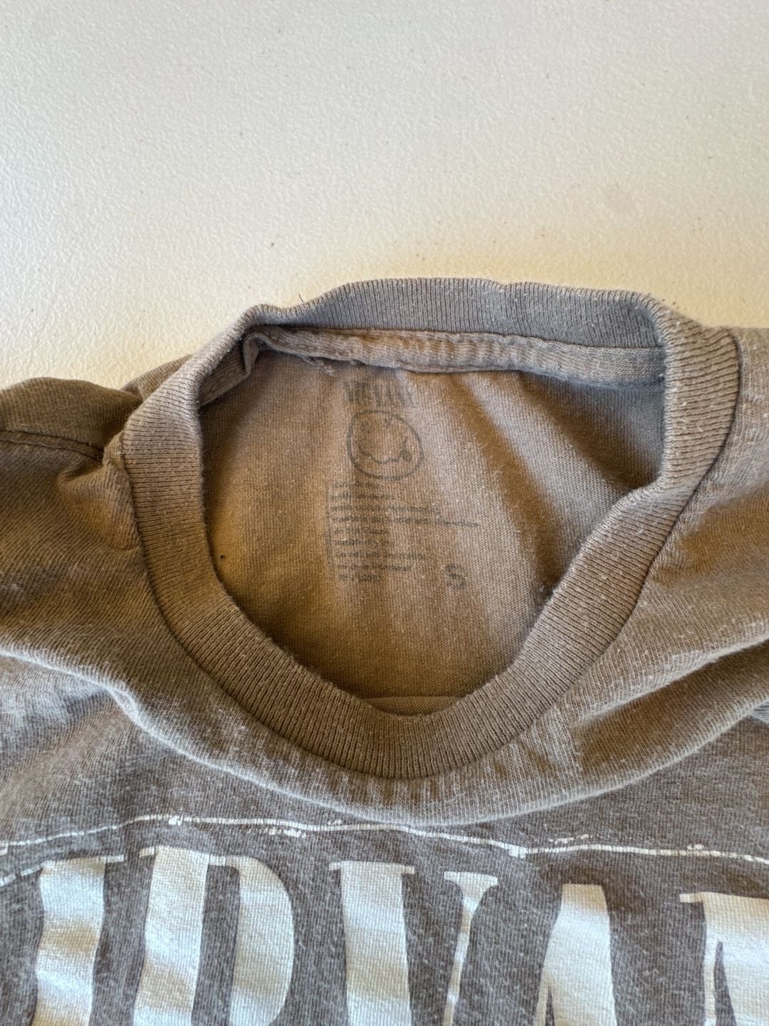 Nirvana Brown Two-Sided Graphic T-Shirt Stencil Logo Smiley Face. Reprint with a gallery