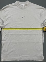 Nike long sleeve mock neck top in Light Bone featuring a small swoosh logo