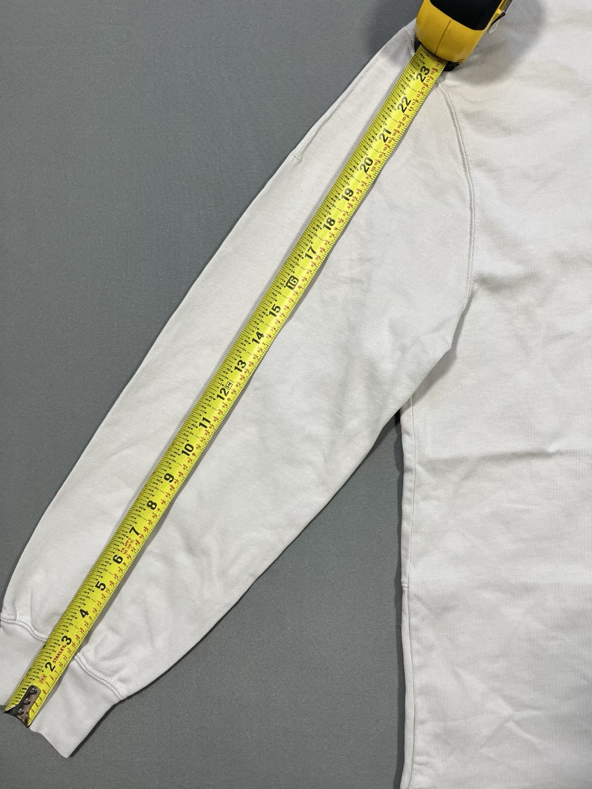 Nike long sleeve mock neck top in Light Bone featuring a small swoosh logo gallery