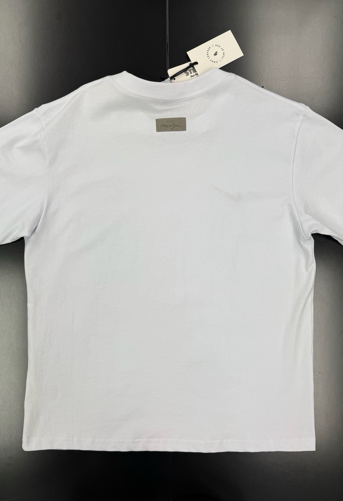 Size L- Fear of God Essentials Tee Cloud Dancer gallery