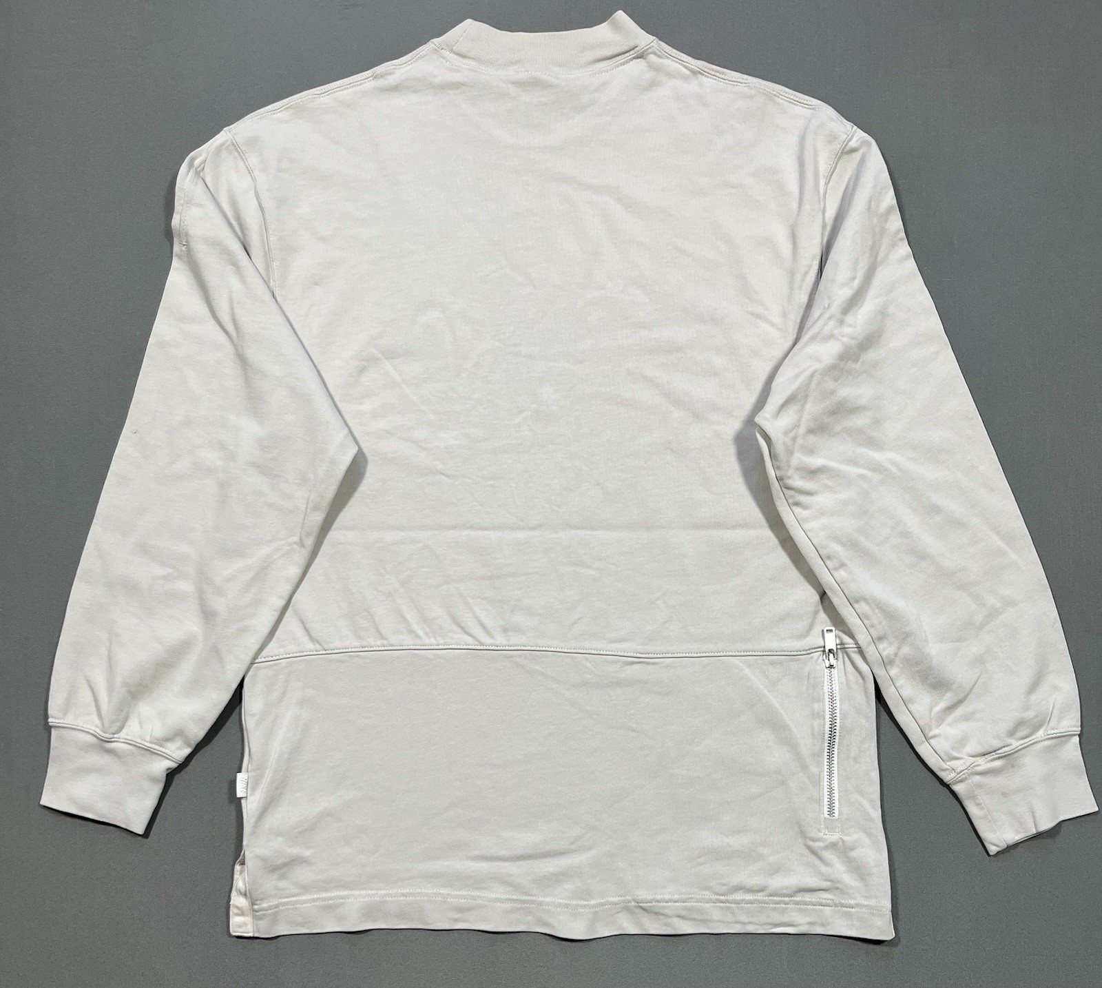 Nike long sleeve mock neck top in Light Bone featuring a small swoosh logo gallery