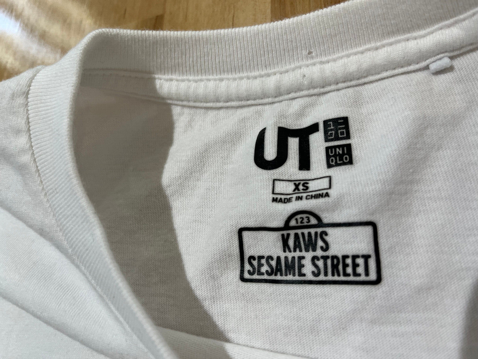Kaws Sesame Street UT X Uniqlo Graphics WHITE T-Shirt - Unisex/Men's XS gallery