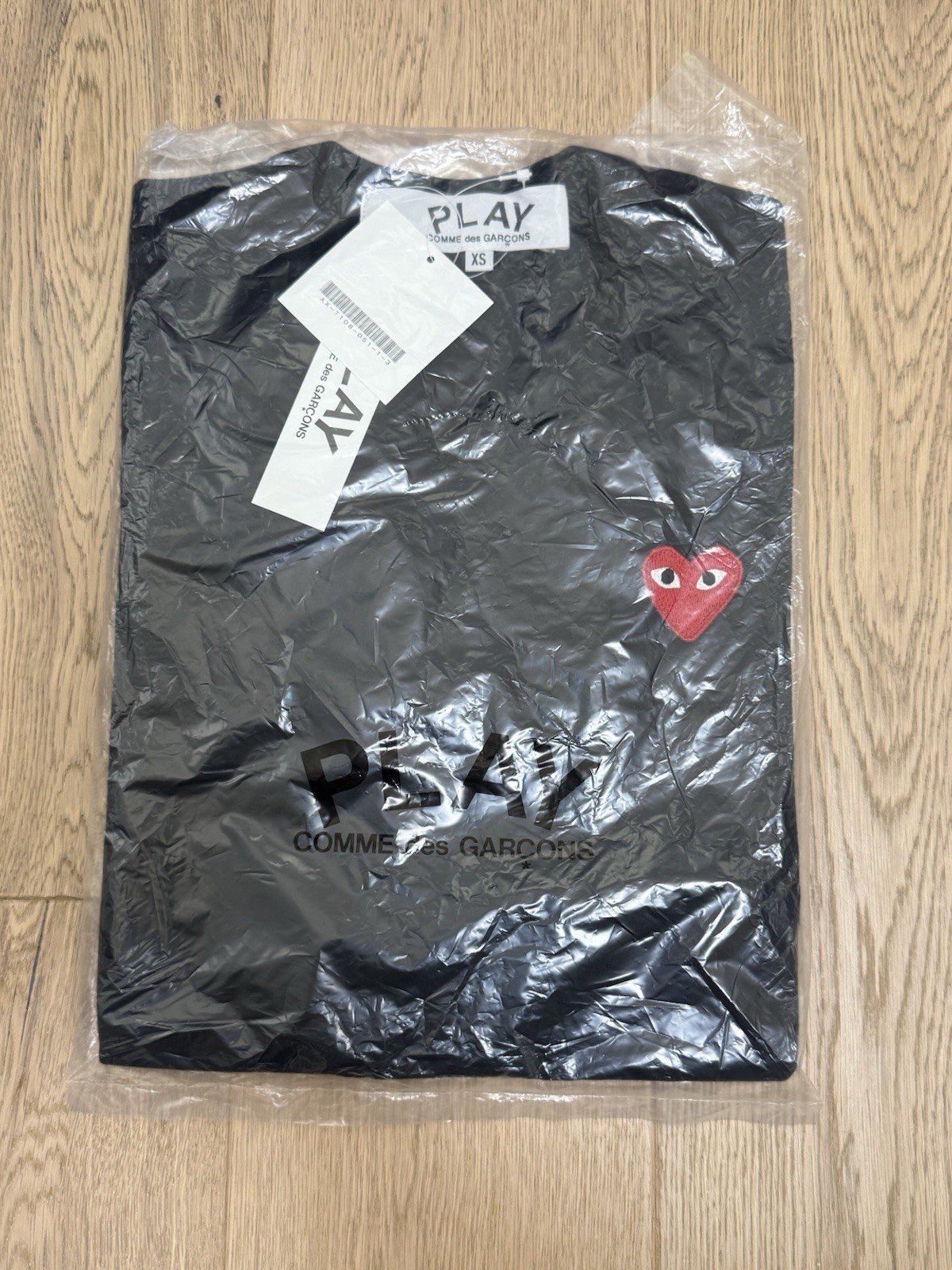 Size XS – COMME des GARCONS CDG PLAY “BLACK” T-Shirts with “RED” HEART EYE LOGO