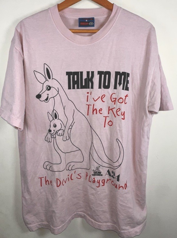 A24 x Online Ceramics Talk to Me Devil’s Playground Horror T-Shirt Pink, L