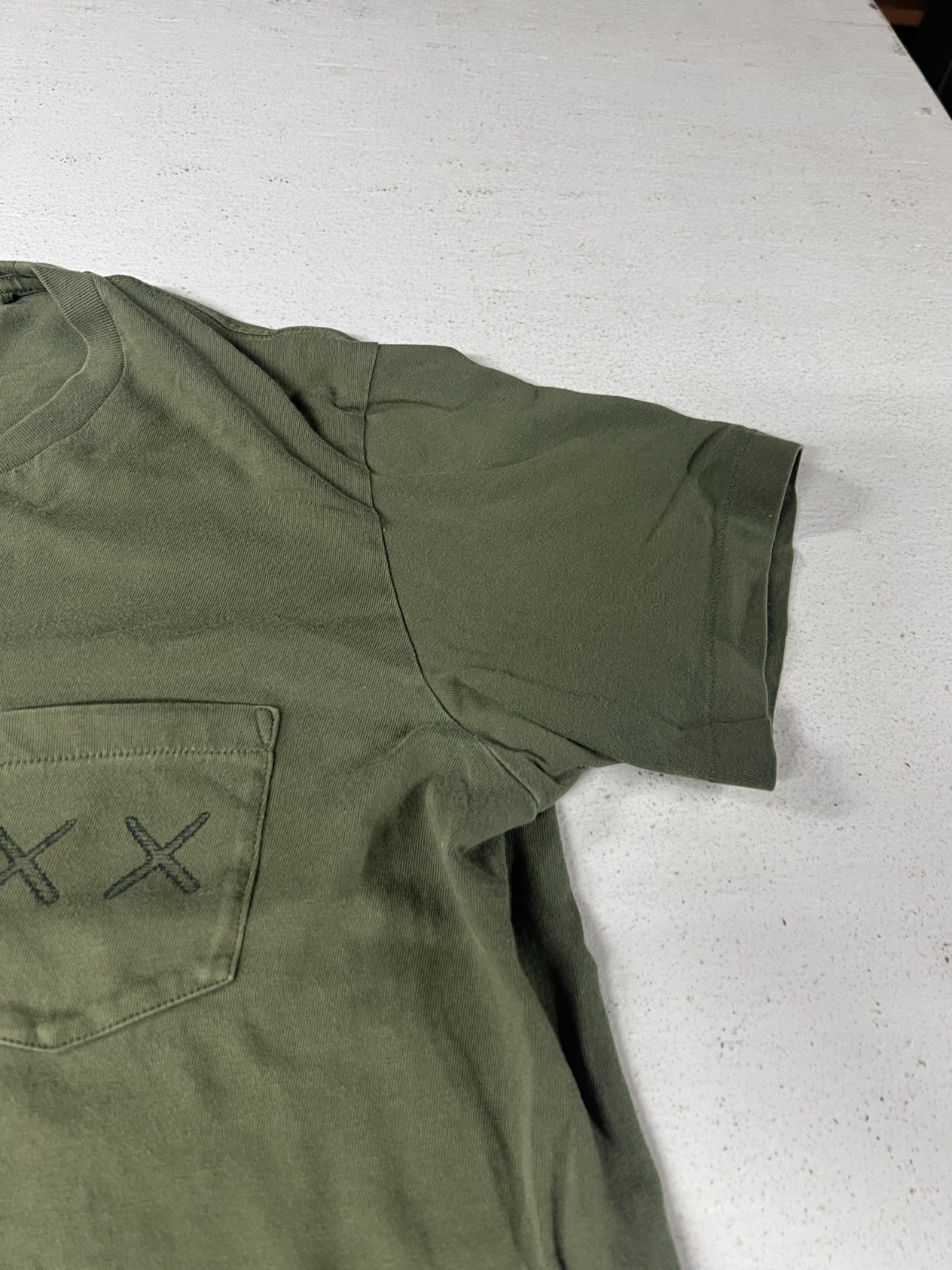 Uniqlo x Kaws T Shirt Olive Green Large Pocket Tee gallery