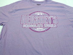 Hersheys Chocolate World Purple T-shirt Size Medium NEW with DEFECT