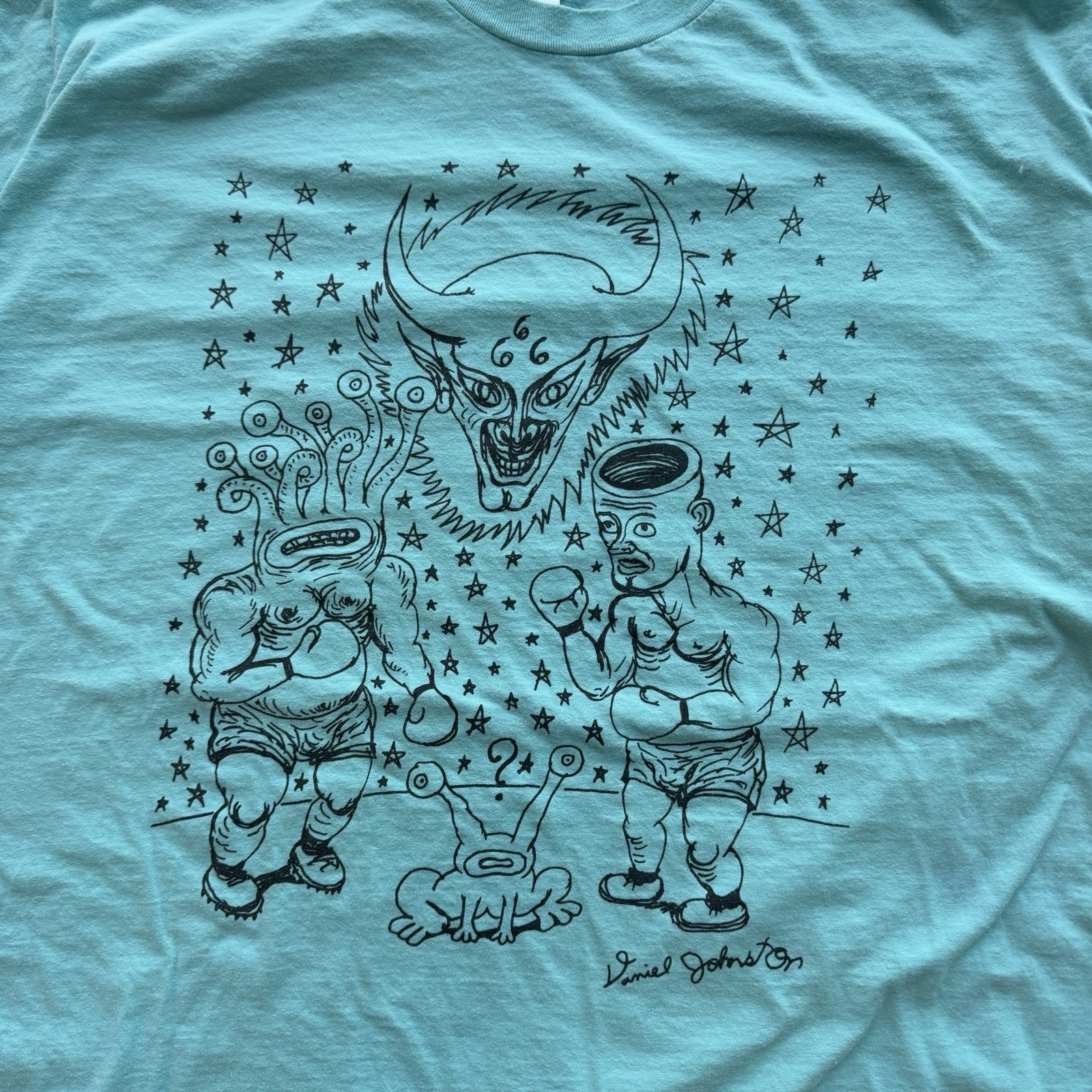 VTG 2000s Daniel Johnston “Good Versus Evil” Boxing Teal Graphic T shirt Sz XL gallery